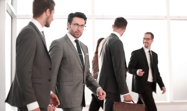 Businessman Talking With Boss In Industrial Interior