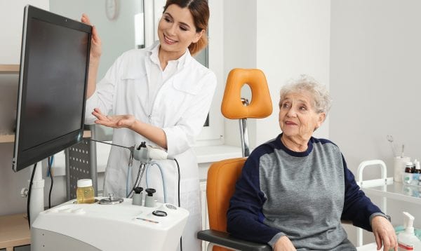 Senior Woman Visiting Professional Otolaryngologist In Clinic. Hearing Disorder