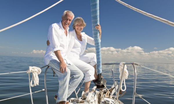 Happy Senior Couple On A Sail Boat